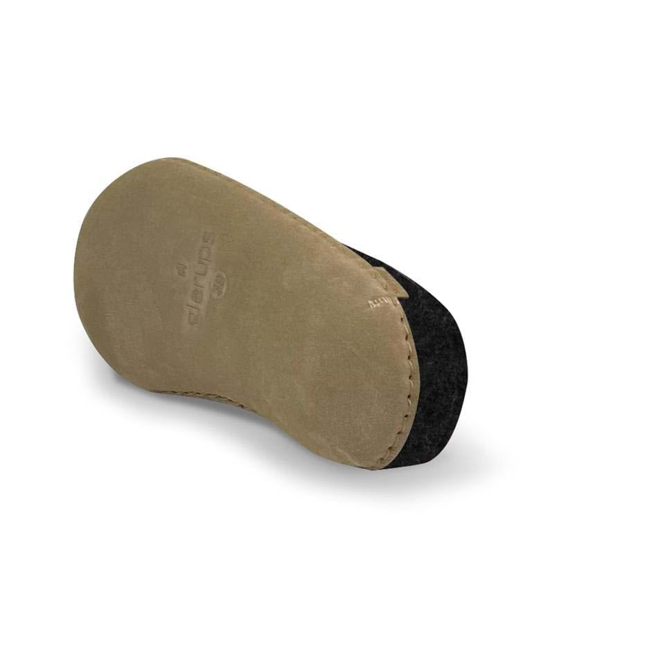 A single Glerups slip-on leather charcoal shoe insole isolated on a white background.