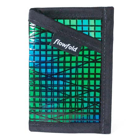 A blue and green plaid patterned Flowfold minimalist wallet against a white background.