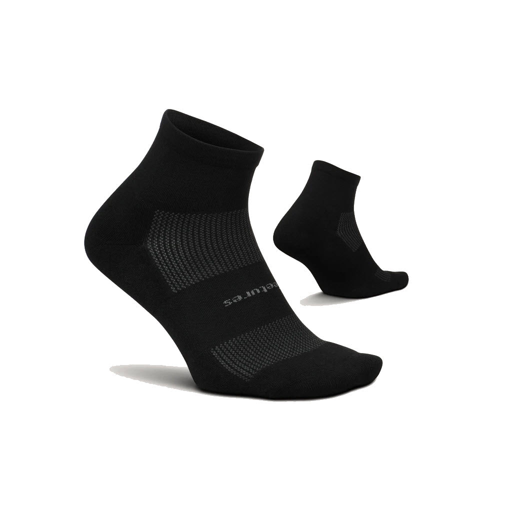 A pair of Feetures High Performance Quarter Sock Cushion ankle socks with moisture wicking fibers on a white background.
