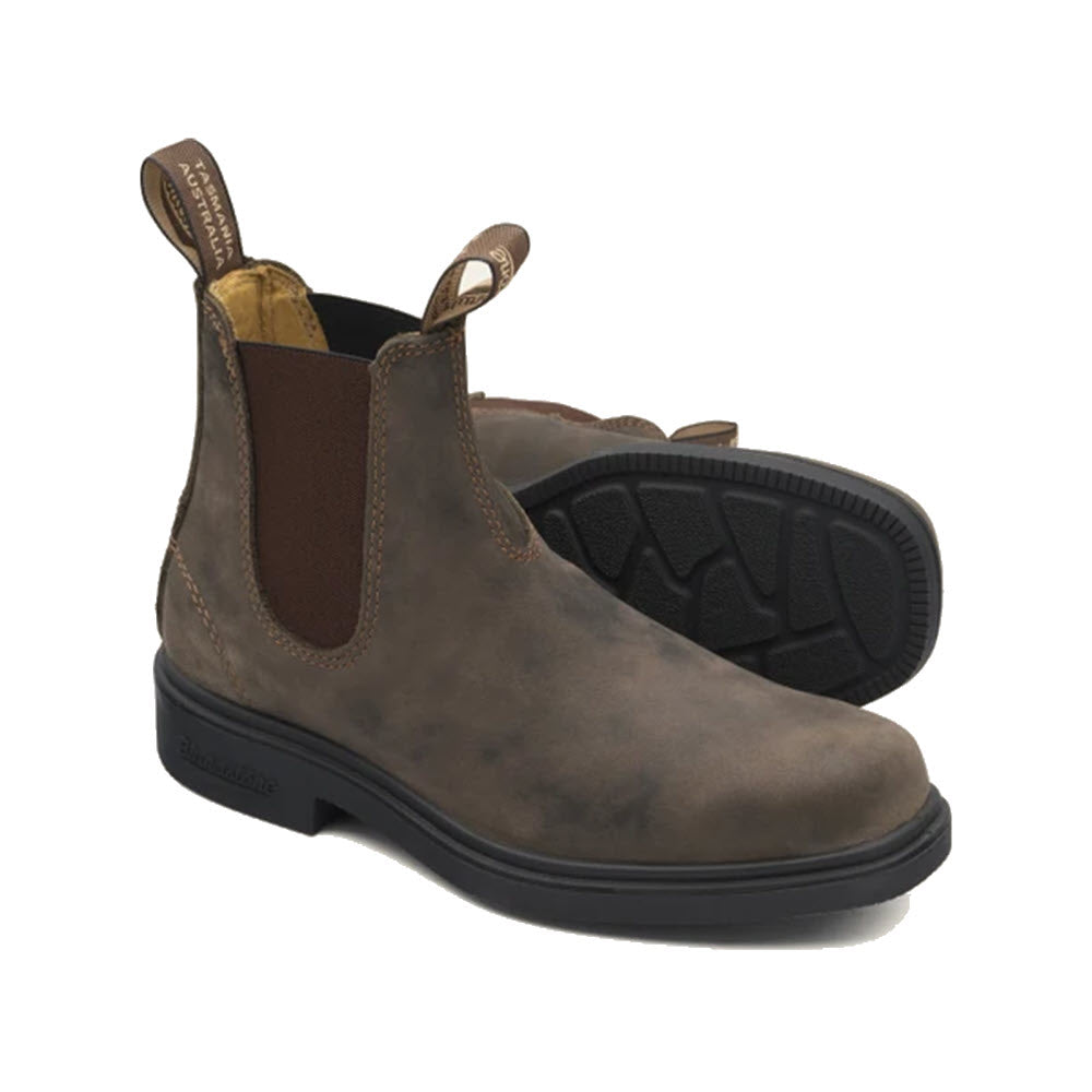 A pair of Blundstone rustic brown leather chelsea boots with black elastic side panels and a chisel toe.