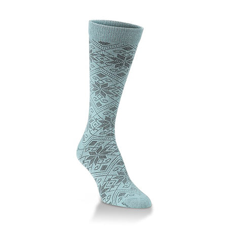 A single light blue patterned Worlds Softest Knitpickin Snowfall Crew Peacock women&#39;s sock displayed against a white background.