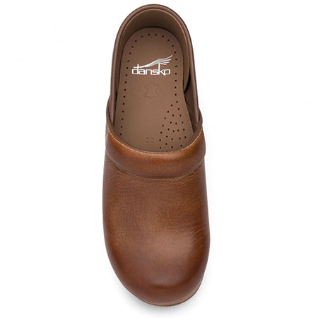A single brown full-grain leather Dansko Professional Honey Distressed clog viewed from above.
