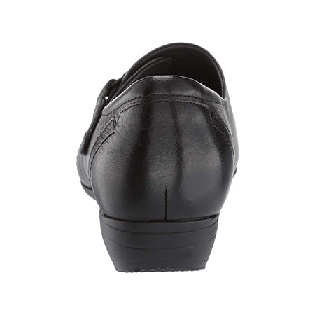 Rear view of a black leather Dansko Franny Milled Nappa Black dress shoe against a white background.
