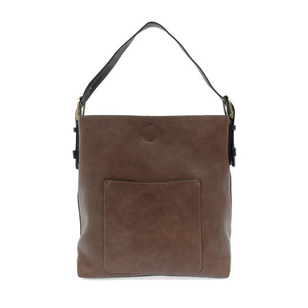 Joy Susan rich mocha leather crossbody bag with a front pocket on a white background.