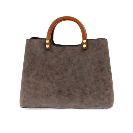 Brown Joy Susan Angie Vintage Satchel Chocolate with wooden handles on a white background.