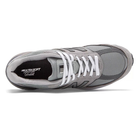 Top view of a gray New Balance 990V5 running shoe with white laces and a cushioned insole.