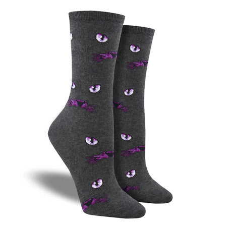A pair of Socksmith Eyeing You socks with purple flower patterns and cat&#39;s eyes displayed on a white background.