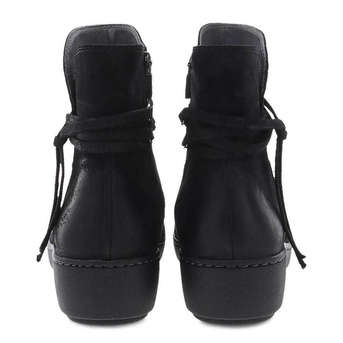 A pair of black lace-up Dansko Evelyn Black Burnished Suede booties viewed from the back.