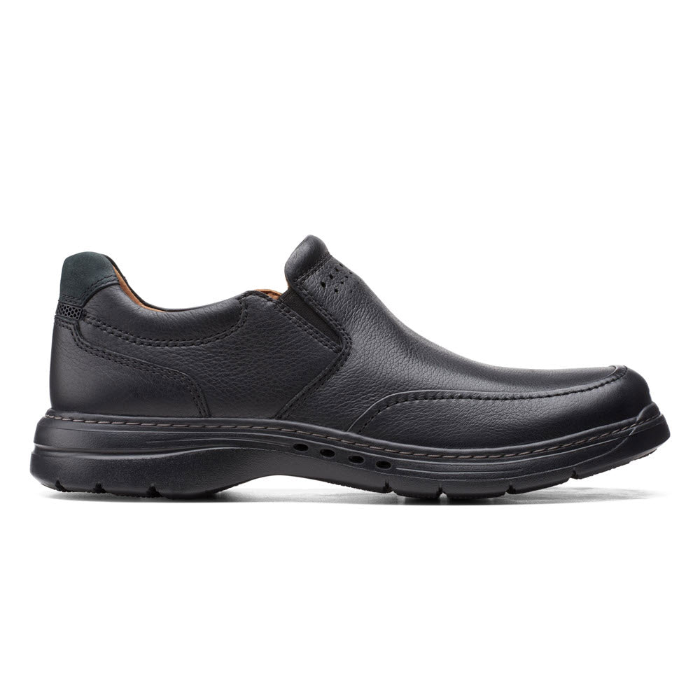 Clarks black leather slip-on shoe with a low profile heel and visible stitching, featuring an OrthoLite® footbed, displayed on a white background.