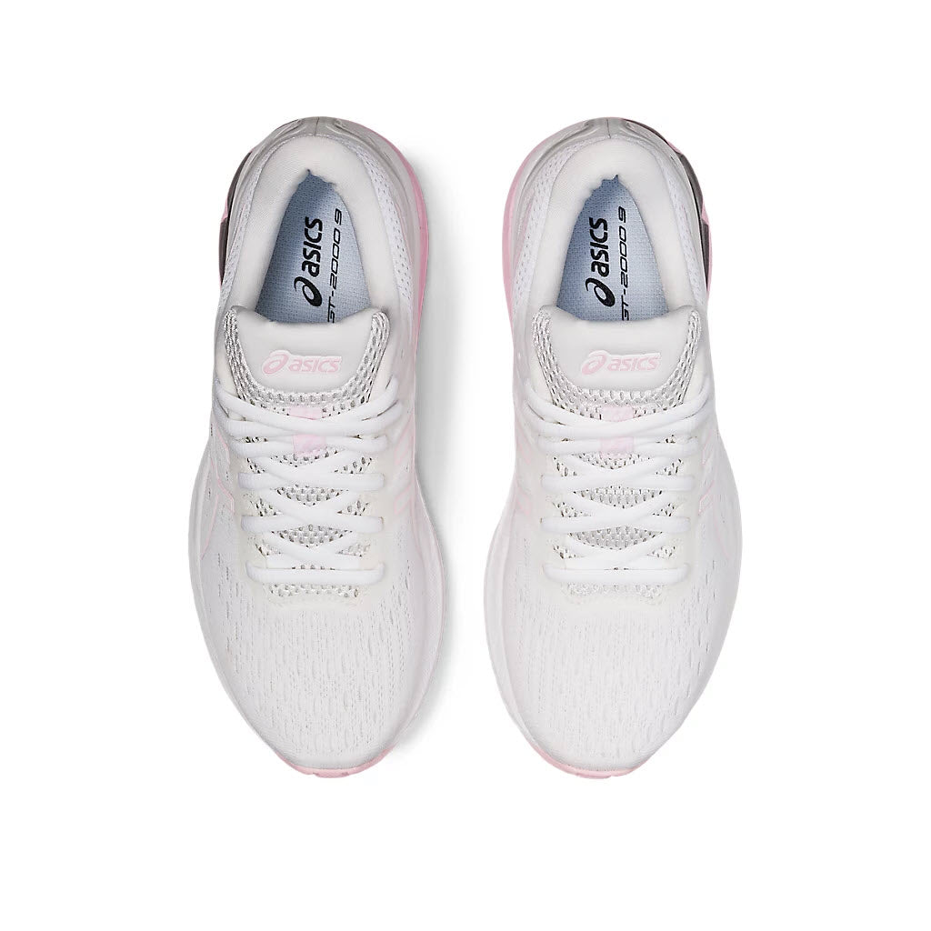 A pair of white Asics GT 2000 v9 women&#39;s running shoes with pink accents viewed from above.