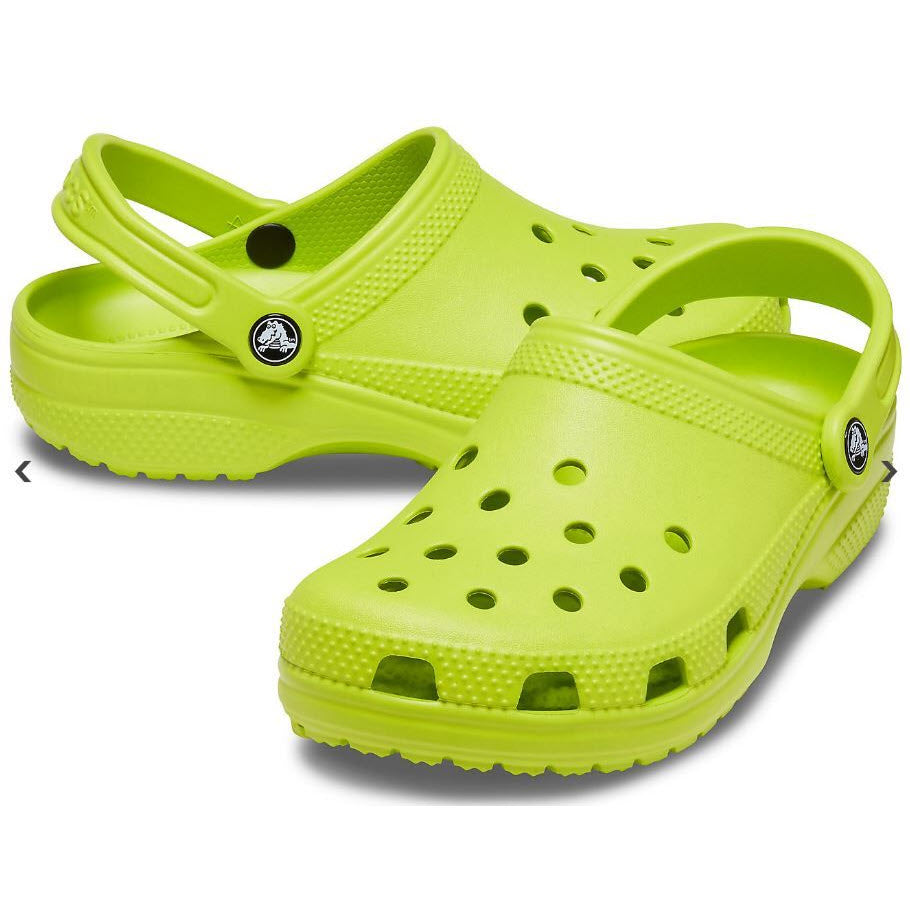 A pair of Crocs Women&#39;s Classic Lime Punch clogs on a white background.