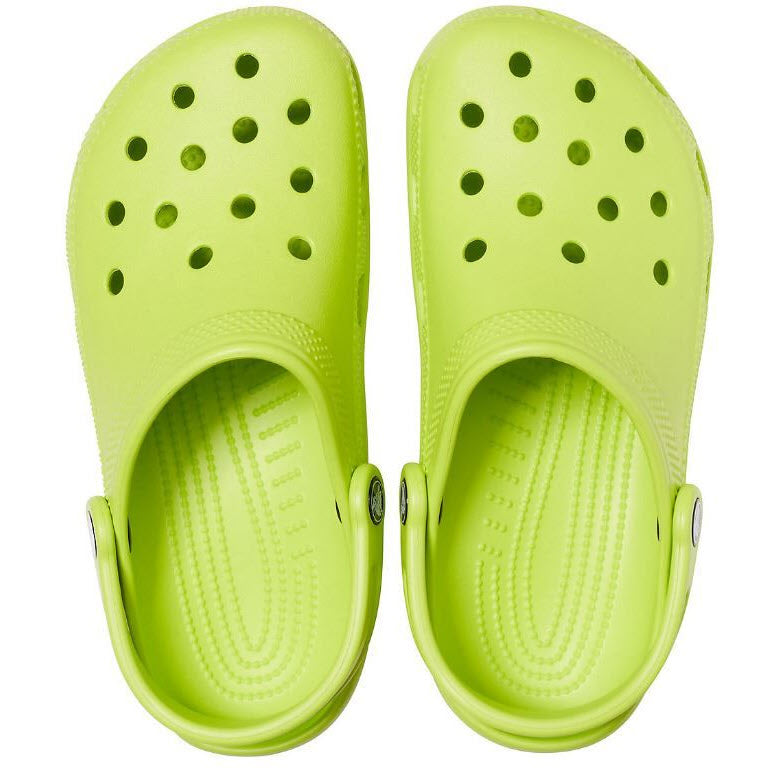 A pair of Crocs Womens Classic Lime Punch clogs with a water-friendly design and ventilation holes.