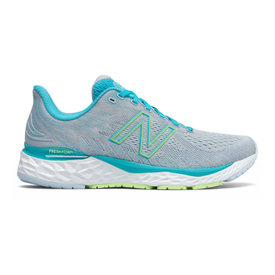 Light blue New Balance 880V11 running shoe with a white Fresh Foam X midsole and green accents, side profile view.