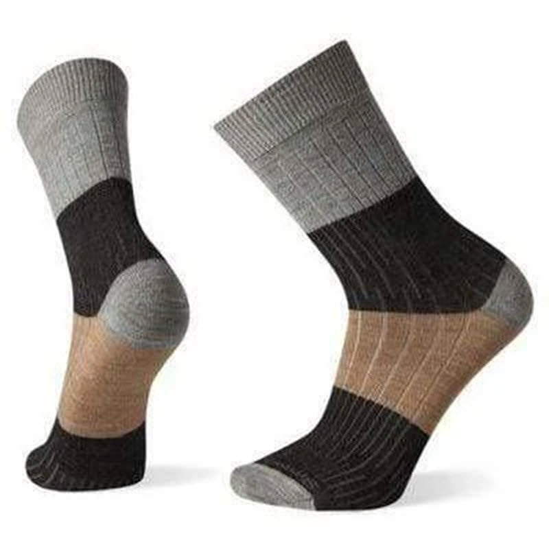 A pair of Smartwool Rib Colorblock Crew Socks in Lunar Grey displayed without a human foot, showcasing different fabric patterns and Smartwool reinforcements for comfort and durability, including a Virtually Seamless toe.