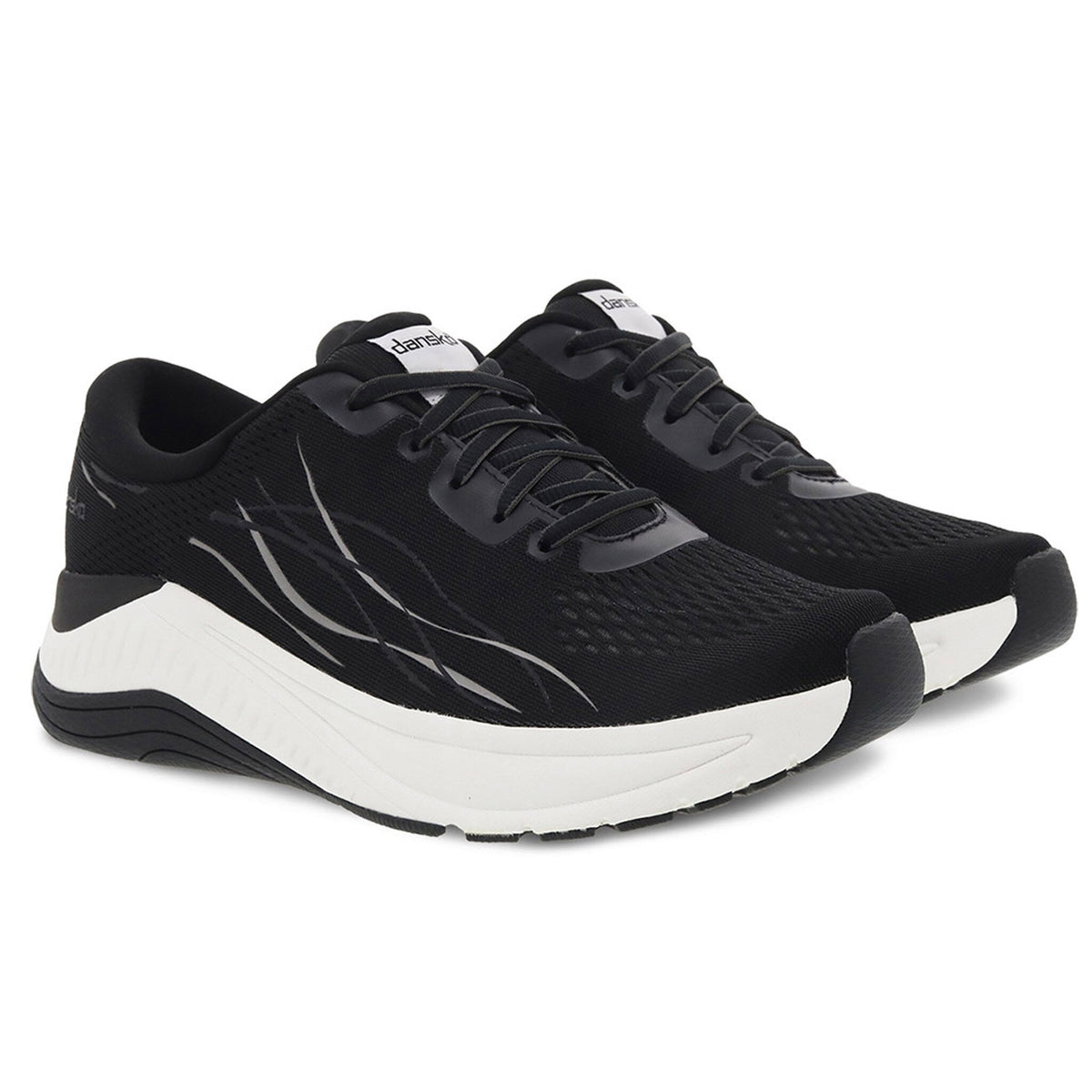 A pair of black and white Dansko Pace Black Mesh walking shoes with odor control on a white background.