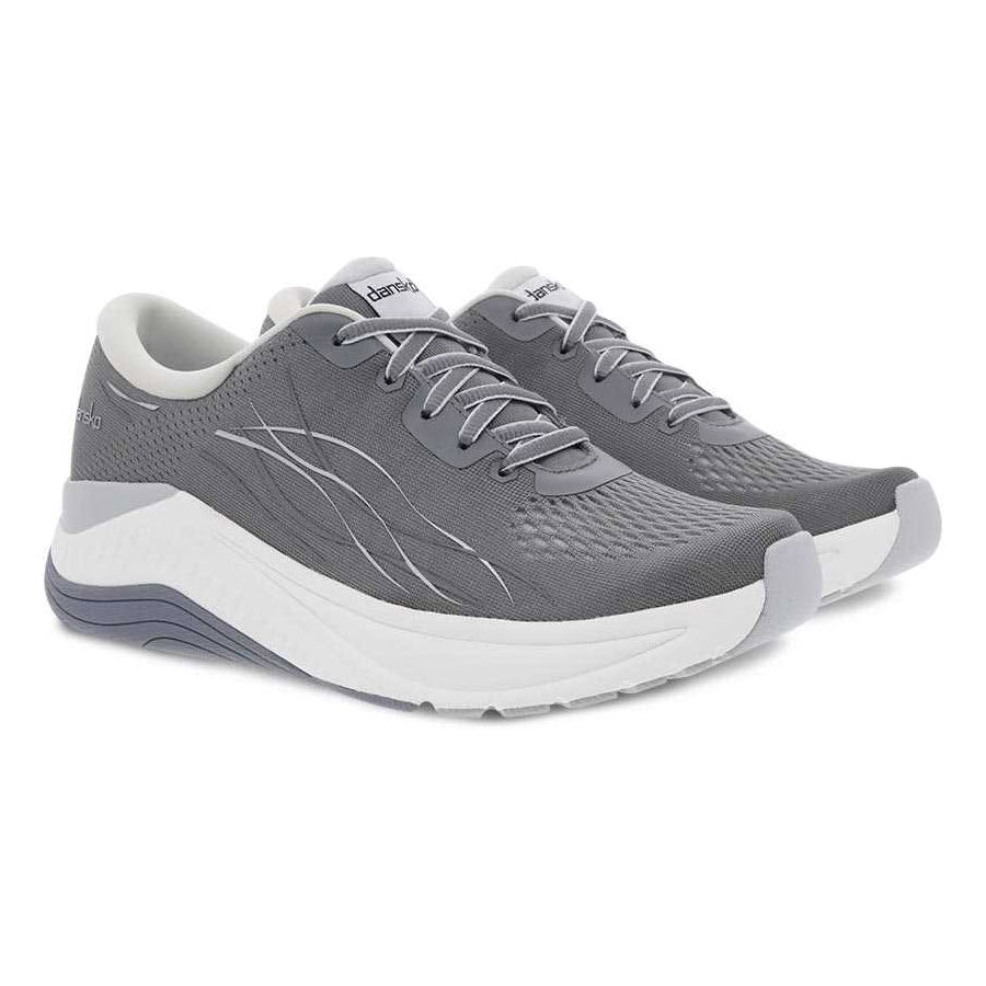 A pair of Dansko Pace Grey Mesh walking shoes with odor control on a white background.