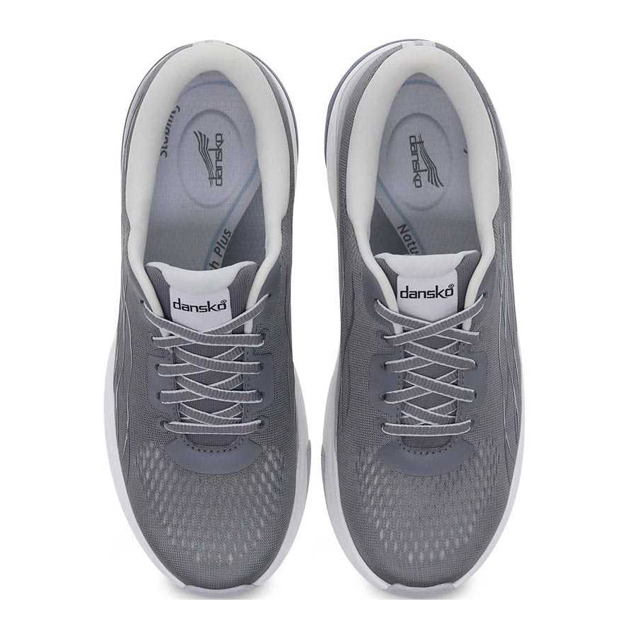 A pair of gray Dansko Pace Grey Mesh walking shoes, featuring Dansko Natural Arch Plus for enhanced comfort, displayed from a top-down view.