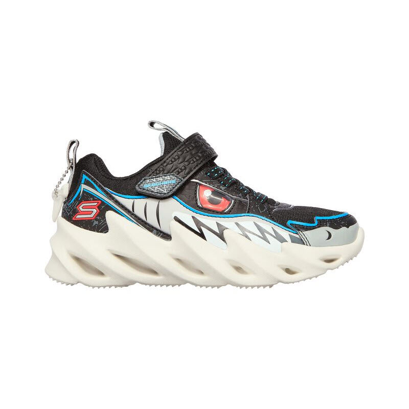 A Skechers SHARK BOTS SURF PATROL BLACK/WHITE sneaker with a chunky sole and a dynamic, eye-catching design featuring a flame-like pattern.