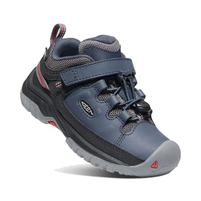 A single Keen Targhee Low Waterproof Blue kid&#39;s hiking shoe with bungee lacing on a white background.