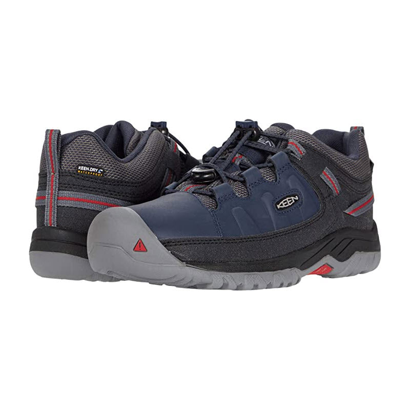Pair of men&#39;s navy blue and gray hiking shoes with red accents and breathable mesh lining. - Keen Targhee Low Waterproof Blue