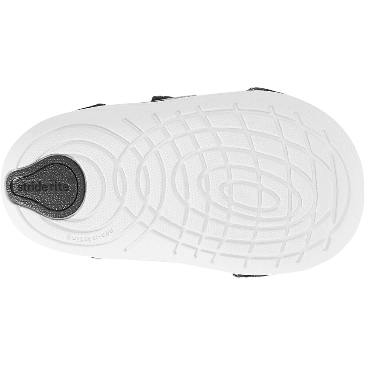 Sole of a Stride Rite kids&#39; athletic shoe with tread pattern and logo.
