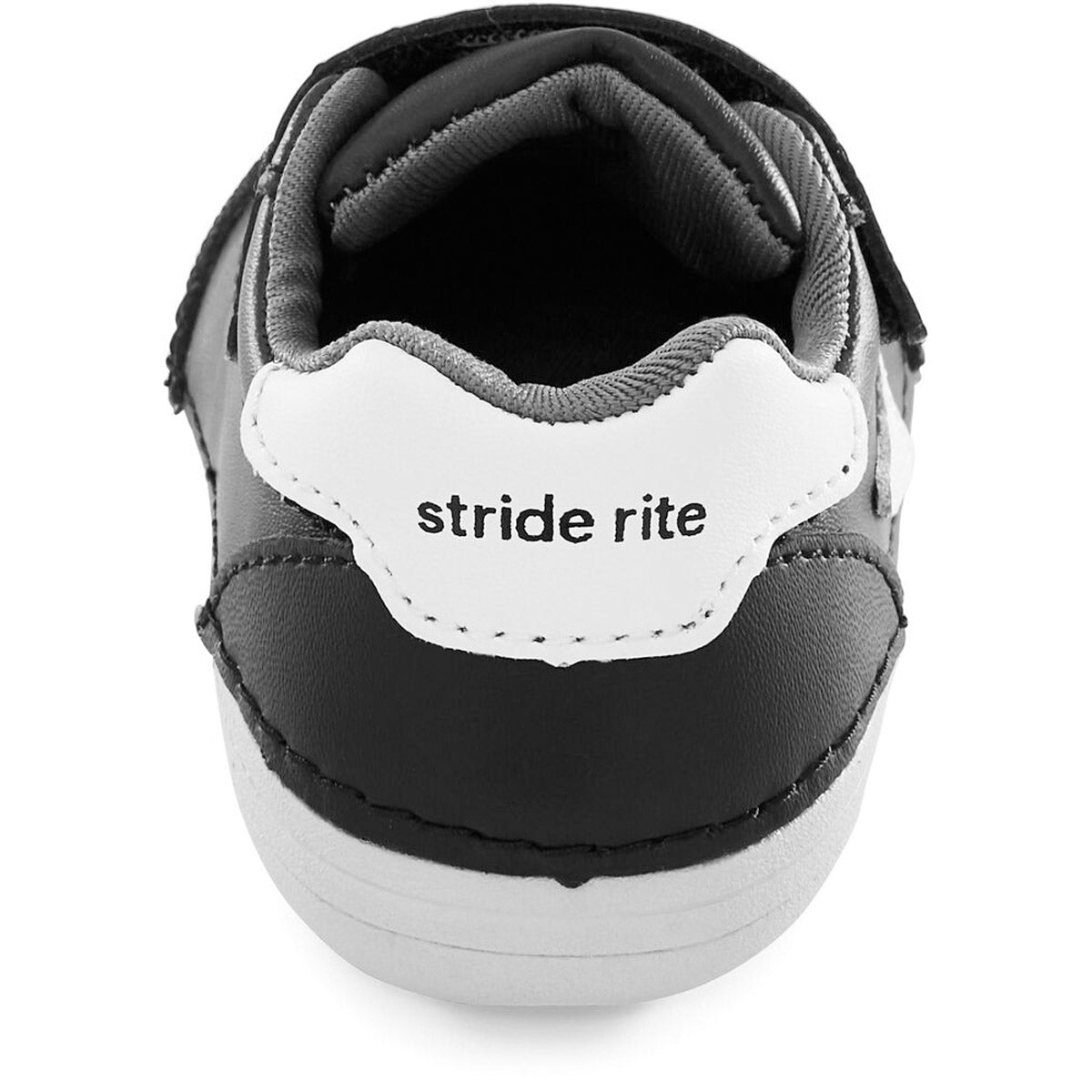 Close-up of the heel of a Stride Rite SM Kennedy Black kids’ athletic shoe.