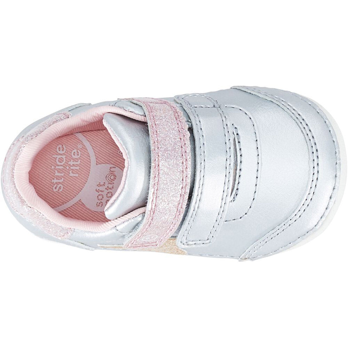 A single Stride Rite SM Kennedy Silver Multi toddler shoe with an adjustable double hook and loop closure.