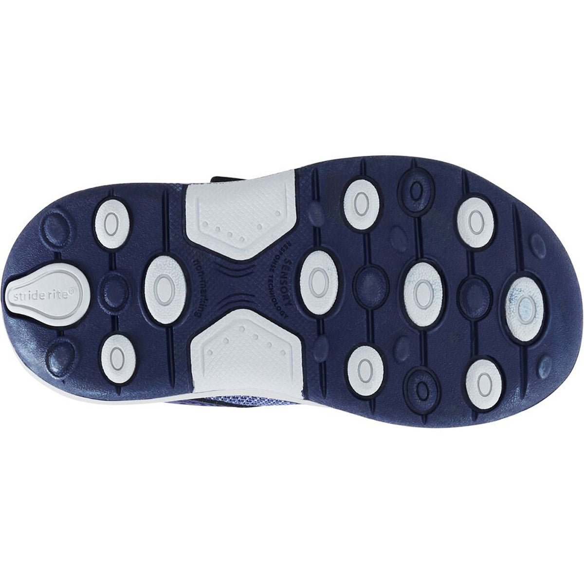 A close-up of the sole of a Stride Rite Winslow Navy Sneaker with blue rubber and white traction pads featuring ground-detecting technology.