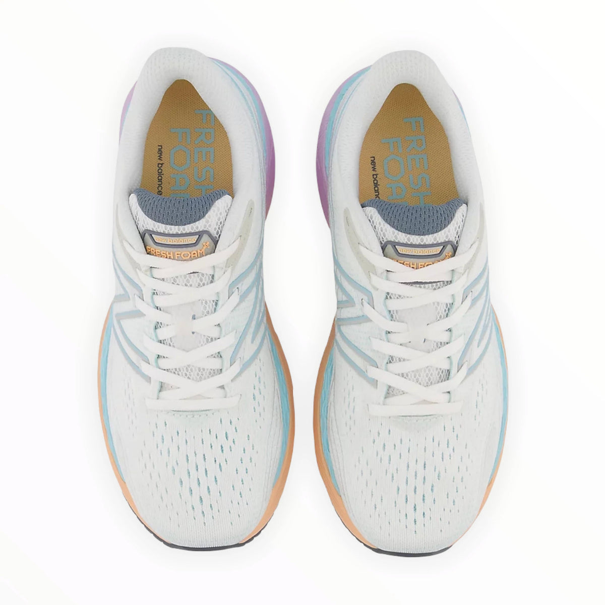 A pair of New Balance 860V12 stability running shoes with white laces, light blue and white uppers, and orange soles, viewed from above.