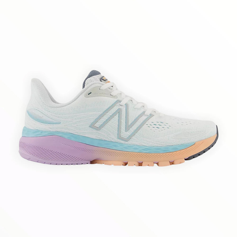 Side view of a light blue New Balance 860V12 stability running shoe with white laces, featuring pink and purple accents on the sole.
