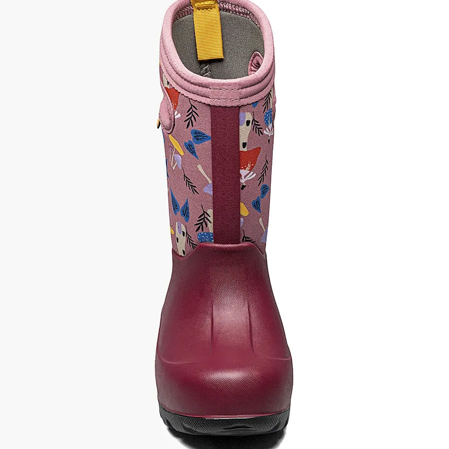 Children&#39;s boot with a maroon lower part and a pink upper part adorned with colorful forest animal illustrations, featuring Bogs Neo-Tech insulation for waterproof warmth and comfort rated to -35°F/-37°C.