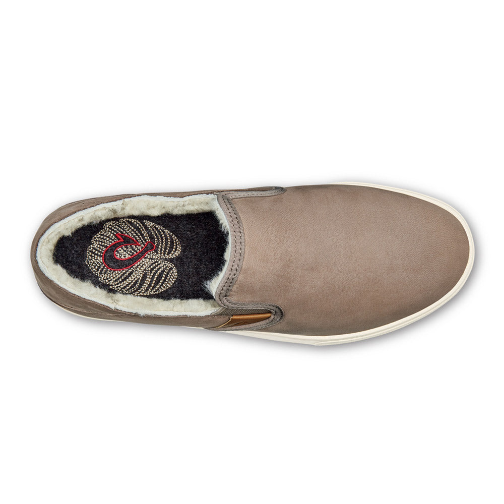 Top view of a single Olukai Pehuea Heu Taupe Grey/Taupe Grey - Womens slip-on shoe with a fuzzy interior lining and an embroidered emblem on the insole, crafted from waterproof nubuck leather.