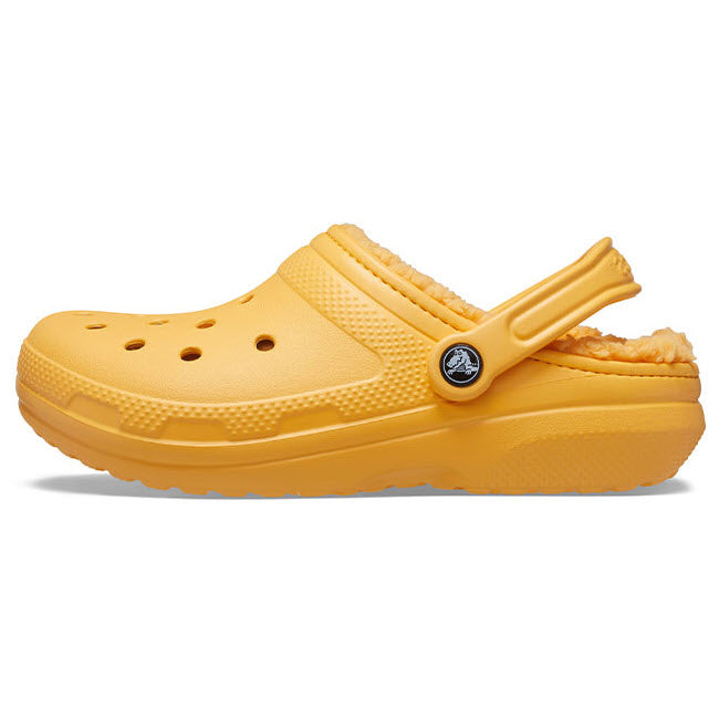 Yellow Crocs Classic Lined Clog with a pivoting heel strap.