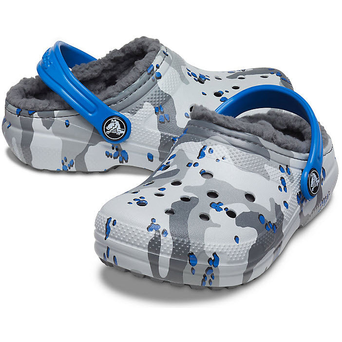 A pair of Crocs Classic Lined Clog Camo Light Grey - Kids with blue accents and a fleece lining.