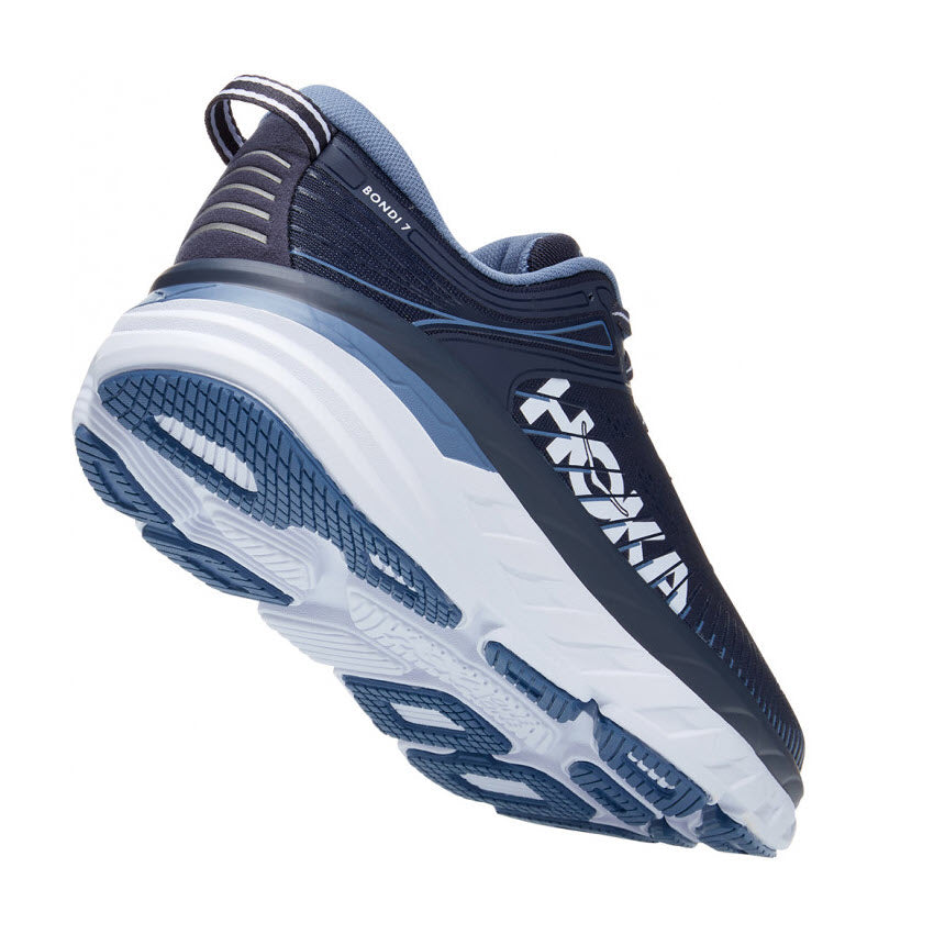 A single navy blue and white Hoka Bondi 7 Ombre Blue running shoe with thick soles, viewed from a side angle.
