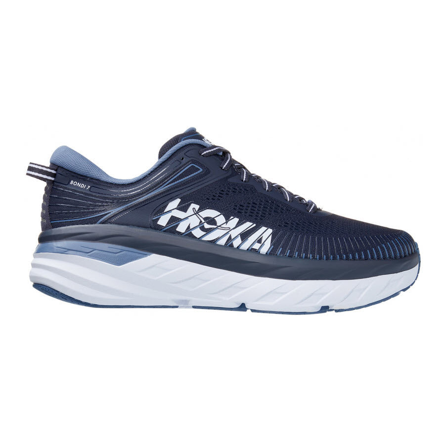 A side view of a Hoka Bondi 7 Ombre Blue - Mens running shoe displaying its thick cushioned sole and navy upper design.