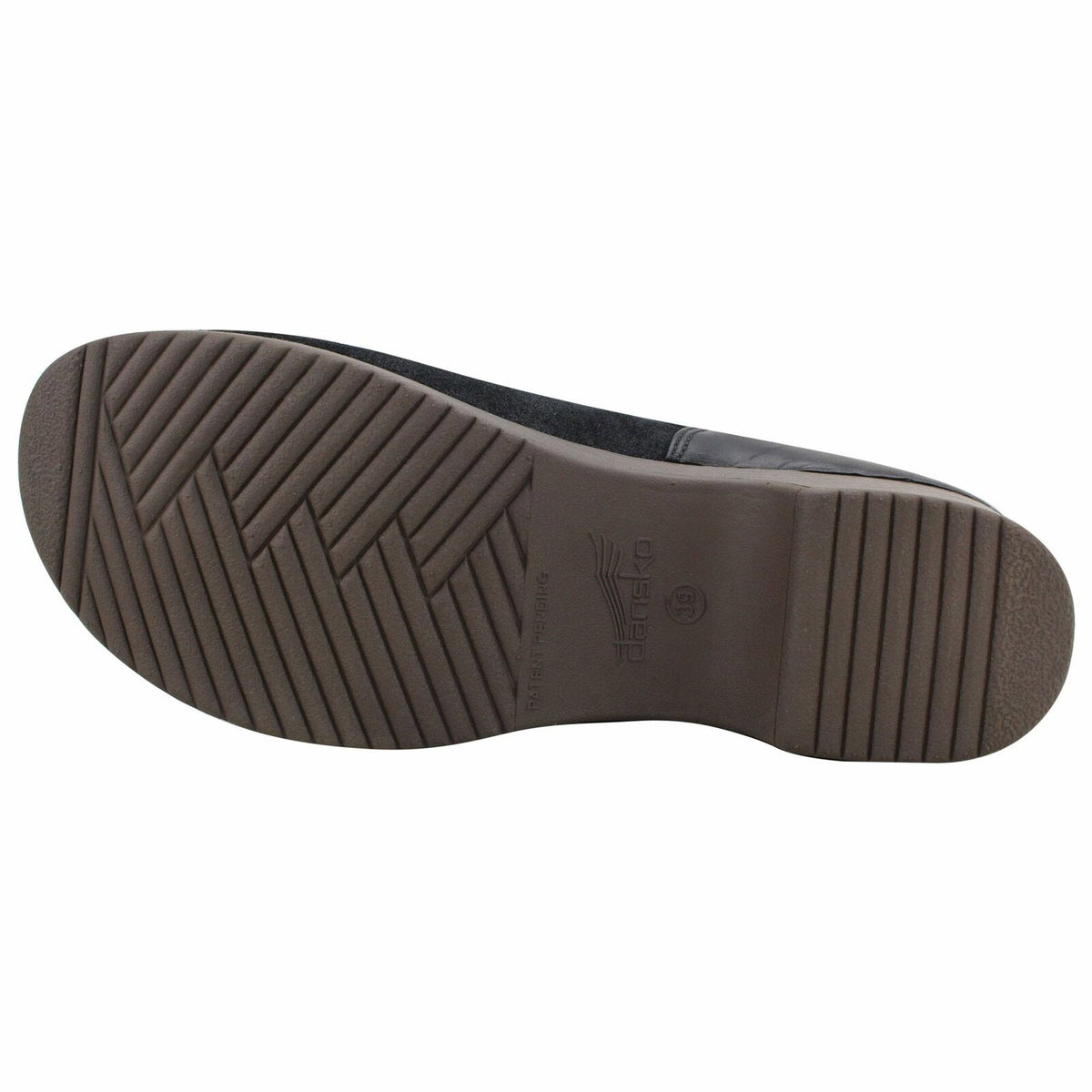 Sole of a brown Dansko Brenna slip-on shoe displaying its tread pattern.