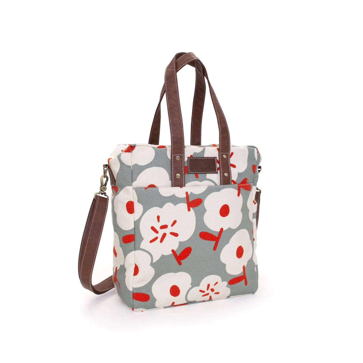 Floral patterned MAIKA COMMUTER TOTE SIERRA with shoulder strap on a white background.