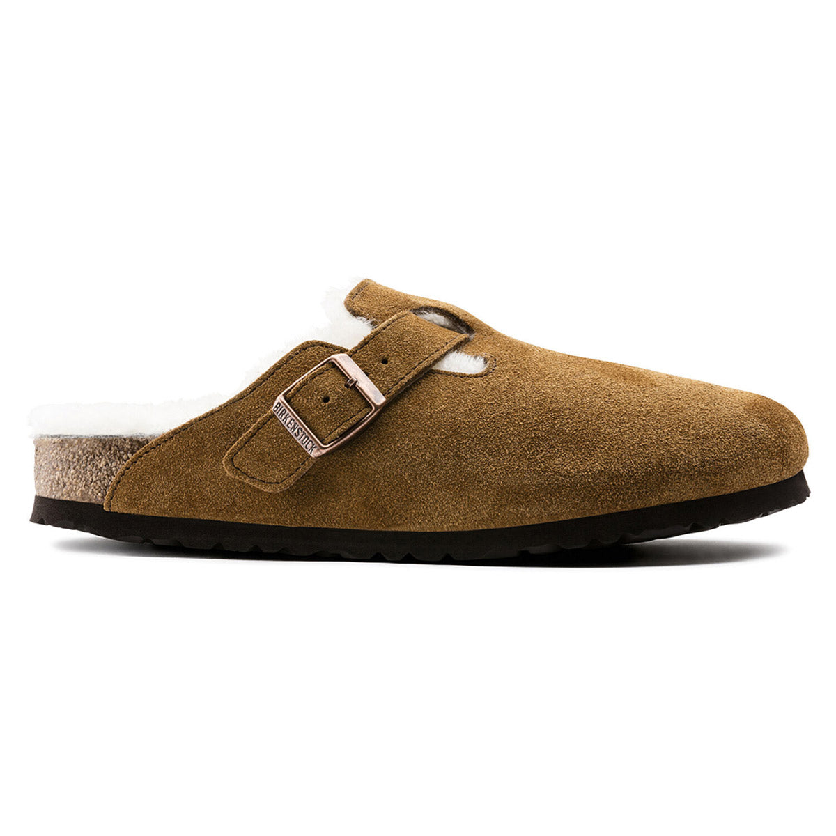 Side view of a single brown suede Birkenstock Boston Shearling Mink clog with a buckle and white wool lining on a white background.