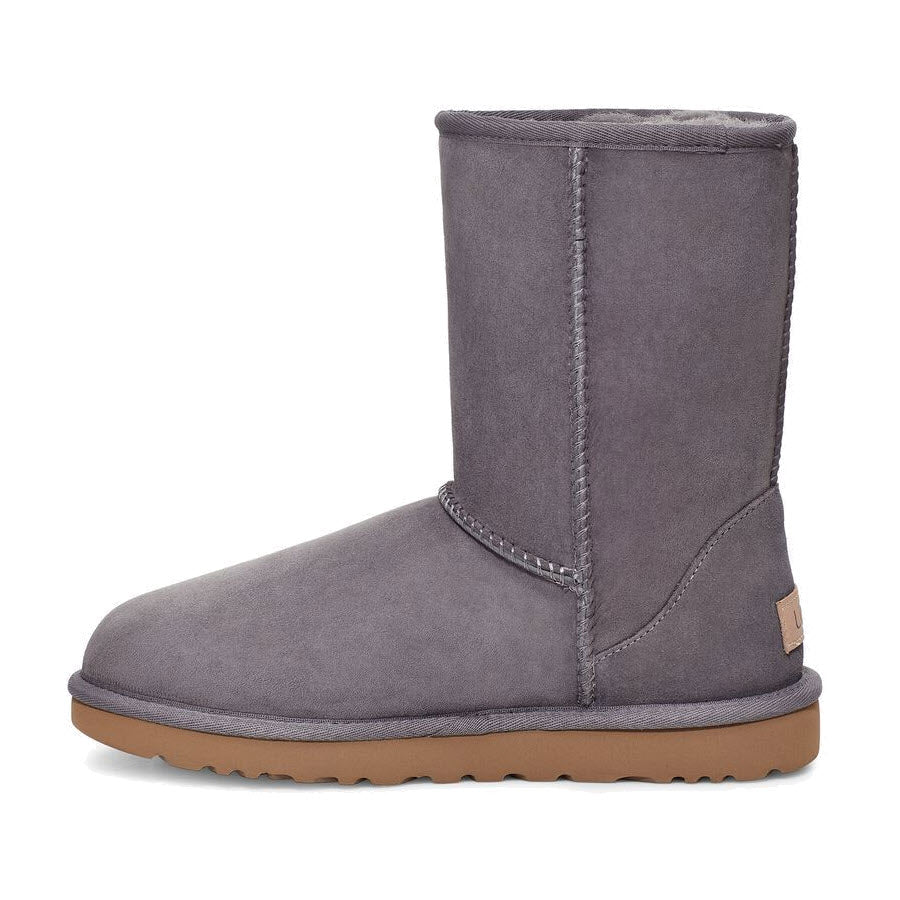 A side view of a single Ugg Classic Short II Shade - Womens sheepskin boot on a white background.