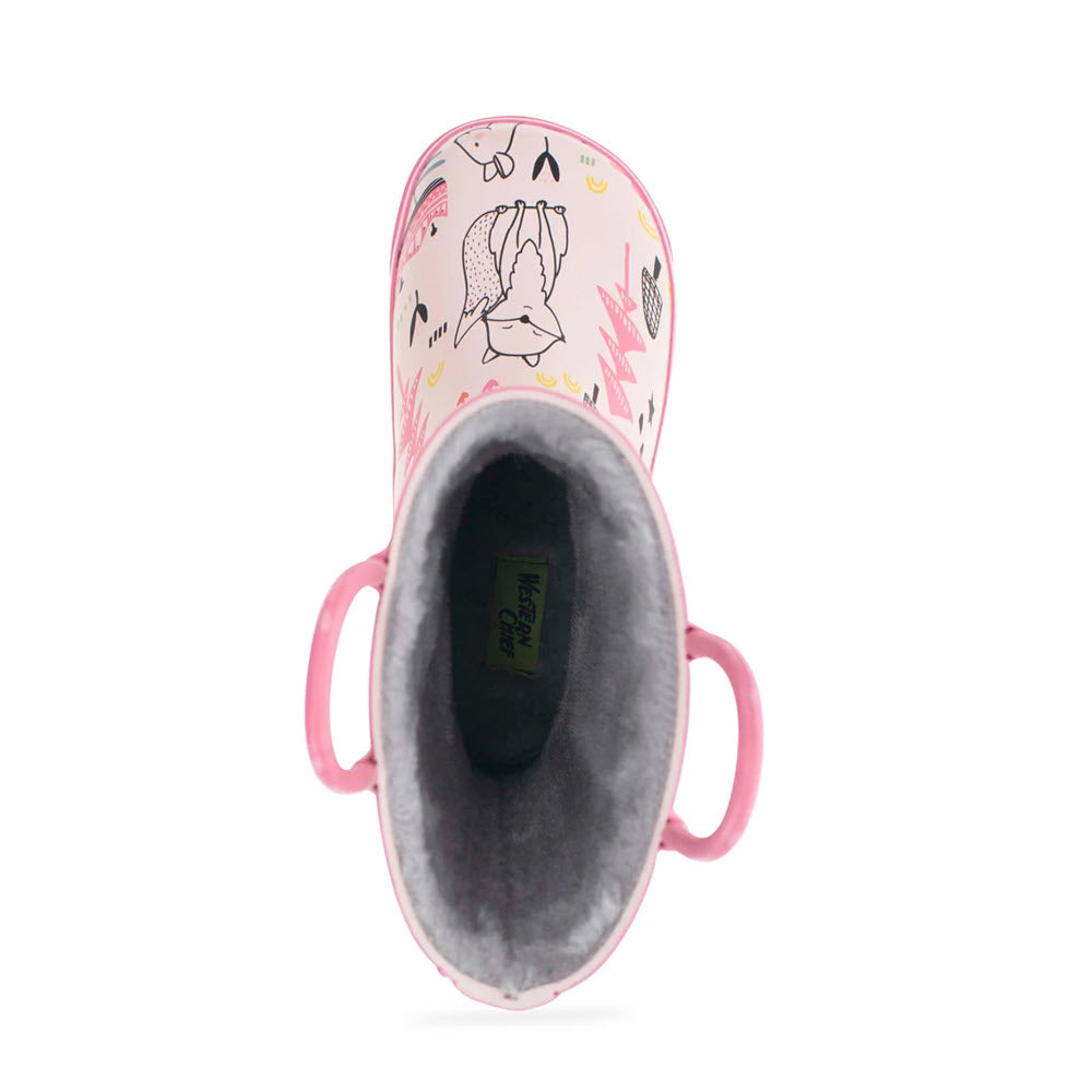 A child&#39;s pink waterproof rain boot with a bunny print, viewed from the top, possibly resembles the WESTERN CHIEF RUBBER BOOT FOREST DOODLE CREAM - KIDS by Western Chief.