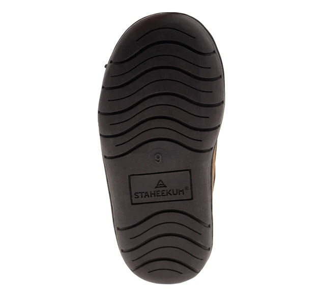 Sole of a Staheekum kid&#39;s slipper with tread pattern and brand logo visible.