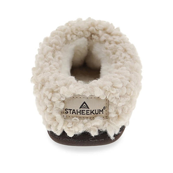 Top-down view of a single fluffy-lined scuff slipper with a visible Staheekum Clemson brand label.