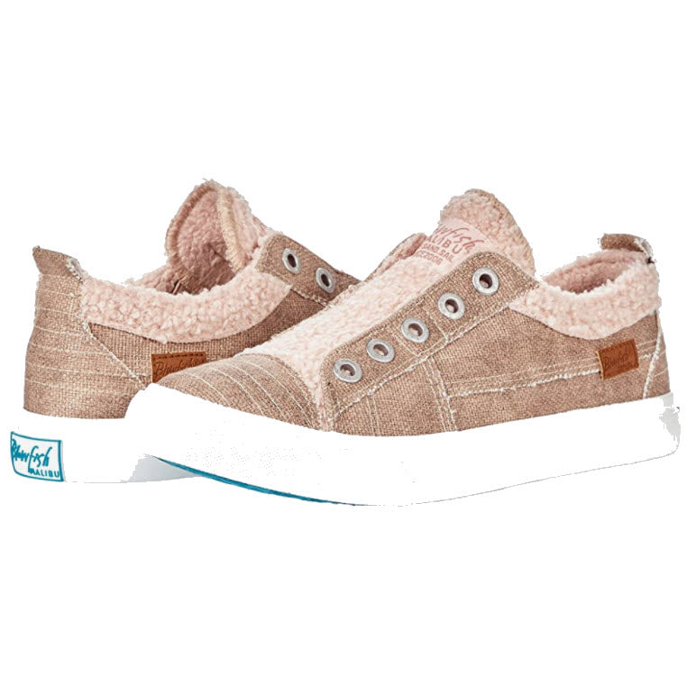 Pair of cozy, Blowfish Playdoe Sherpa rose gold metallic women&#39;s sneakers with no laces on a white background.
