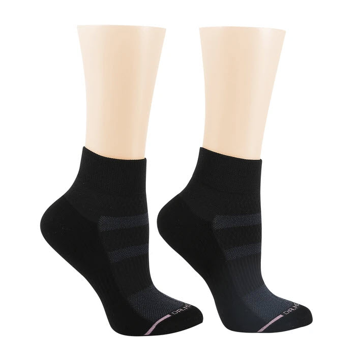 A pair of black Dr. Motion athletic compression socks displayed on mannequin feet.