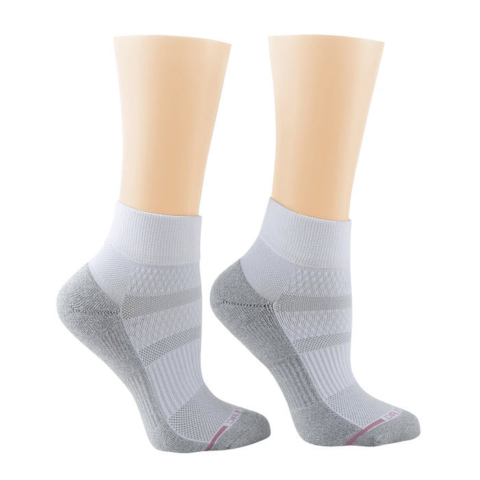 Pair of Dr. Motion quarter height compression socks in white on mannequin feet.