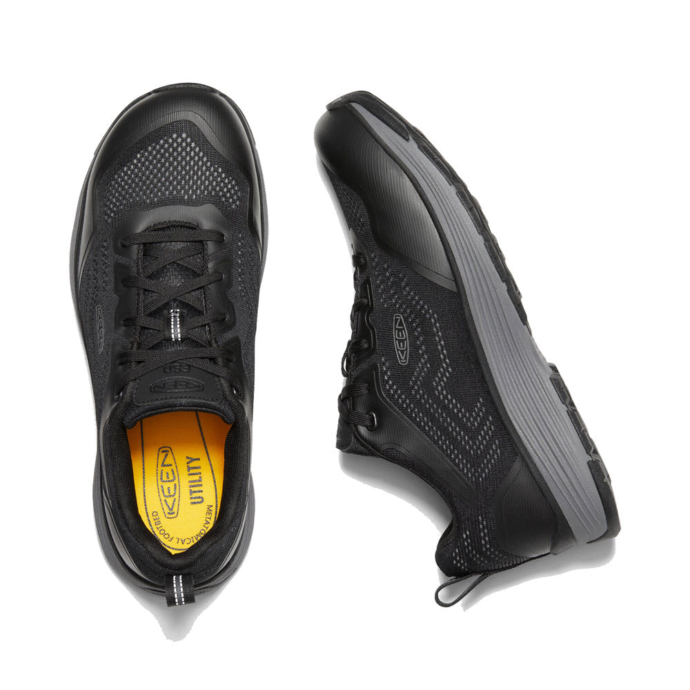 A pair of black Keen SPARTA II Safety Toe EH athletic shoes with a distinctive yellow insole and an ASTM-rated aluminum safety toe, viewed from above.