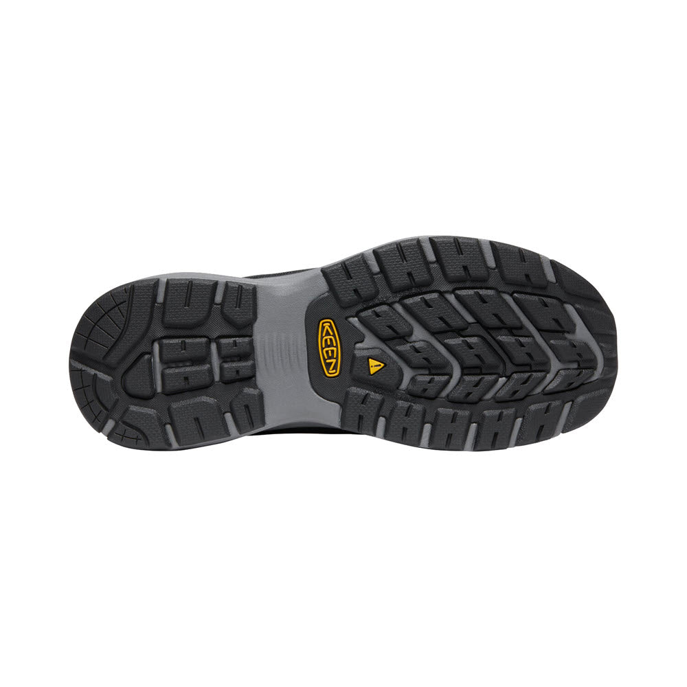 Tread pattern of a black rubber sole from a KEEN SPARTA II SOFT TOE ESD BLACK/GRAY - MENS hiking shoe with brand logo and KEEN.ReGEN midsole.