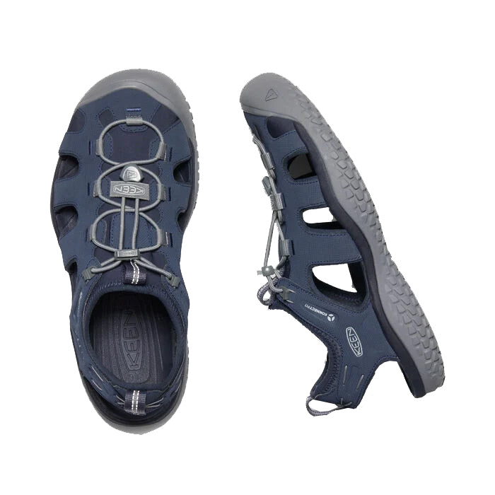 A pair of Keen SOLR sandals in navy blue with adjustable straps and quick-dry lining, displayed on a white background.