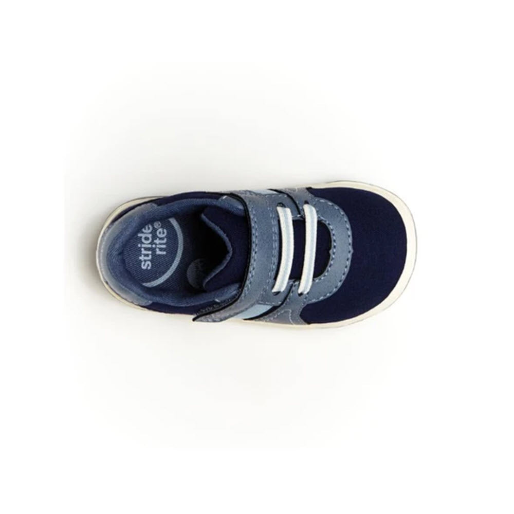 A single blue and gray toddler&#39;s Stride Rite Thompson Navy sneaker with velcro straps, viewed from above.